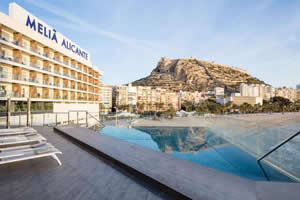 a view of the beach from the swimming pool of the Melia Alicante